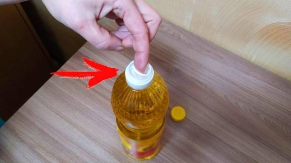 Для чего нужно «колечко» в бутылке с подсолнечным маслом и как правильно открывать ее Для чего нужно «колечко» в бутылке с подсолнечным маслом и как правильно открывать ее